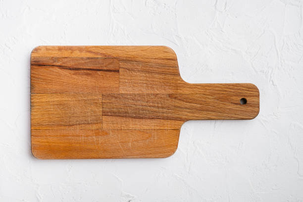 istock Empty vintage cutting board, on white stone table background, top view flat lay , with copy space for text or your product 1339436915