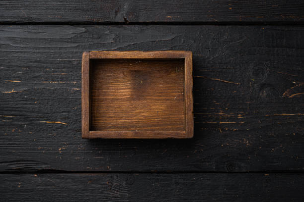 istock Rustic wooden box or container with copy space for text or food, top view flat lay , on black wooden table background 1339437428