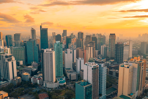 Beautiful sunset of Skyscrapers and shopping malls in Makati, Philippines Metro Manila region and financial hub