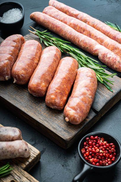 istock Traditional raw sausages, on black background 1339442675