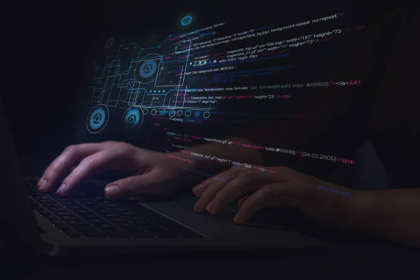istock Hacker working with laptop at table, closeup. Cyber attack 1339445445
