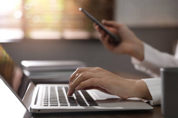 istock Woman working with laptop in office, closeup 1339445544