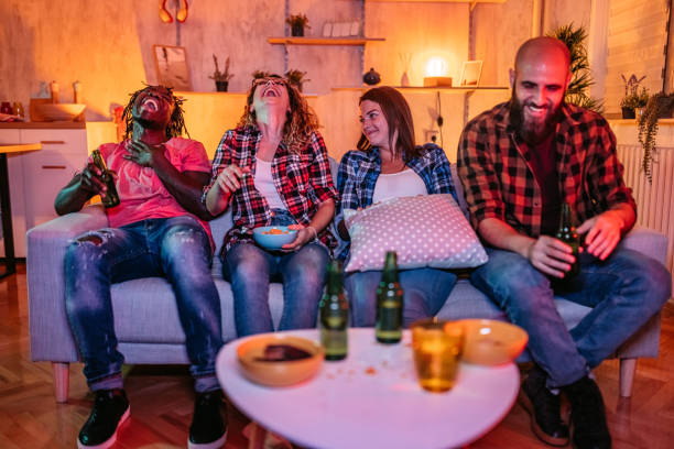 istock Friends drinking beer and watching movie 1339447892