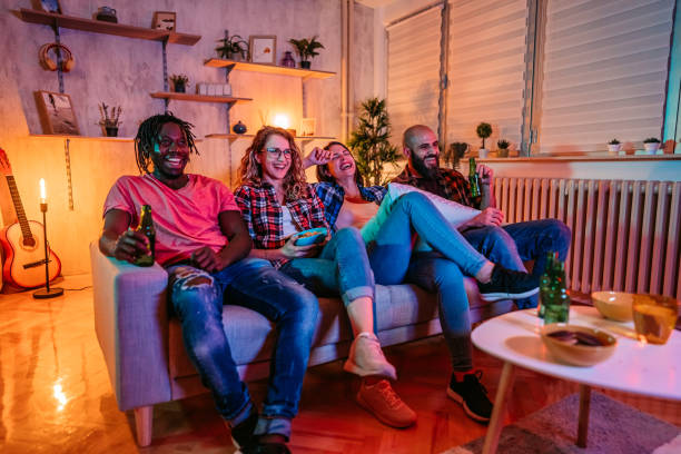 istock Friends drinking beer and watching movie 1339448027