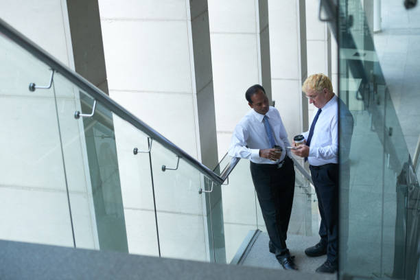 istock Mature Entrepreneurs Standing on Staircase 1339449636