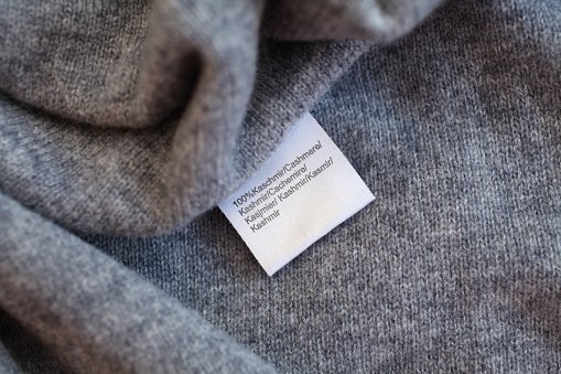 Grey, soft, cashmere background with tag