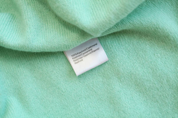 istock Green cashmere background with label 1339450406