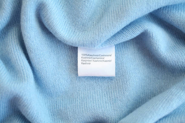 Blue cashmere fabric with tag stock photo