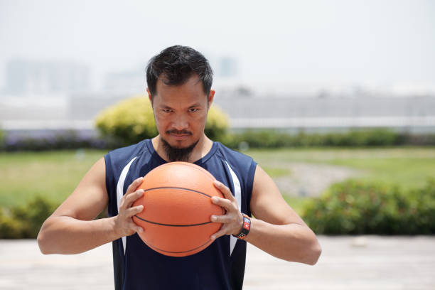 istock Determined Basketball Player with Ball 1339450551