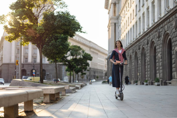 istock Student riding e-scooter in the city 1339451741