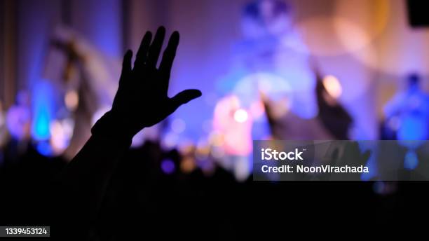 Hands Raising Concert Hands Raising For Religion Background Stock Photo - Download Image Now