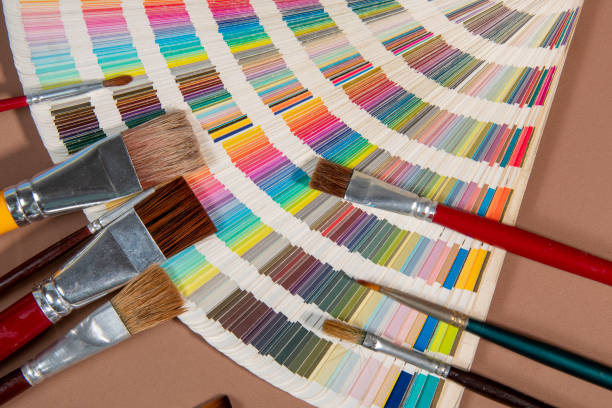 istock Close-up on color palette guide for printing and paintbrush 1339454529