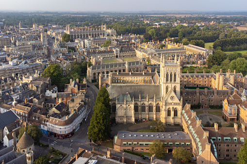 Aerial establishing shot of Oxford, England, flying over the city centre buildings and the colleges and libraries of the famous university.