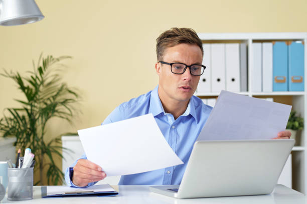 istock Businessman in Reading Contracts and Reports 1339455842