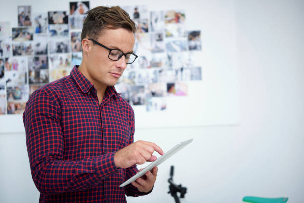 istock Photographer Uploading Photos on Social Media 1339455873