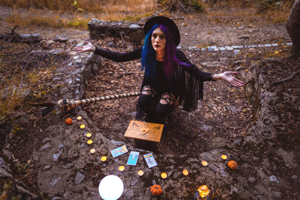 istock Young witch, fortune teller reads Tarot cards. 1339458872