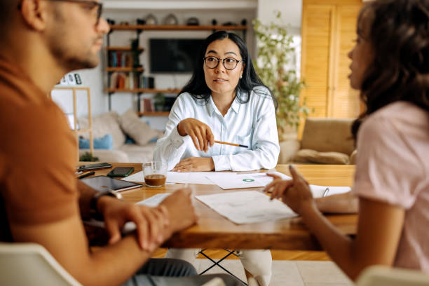 istock Young couple getting advice from financial expert 1339459570