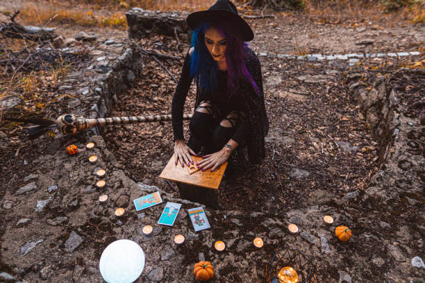 istock Young witch, fortune teller reads Tarot cards. 1339459628