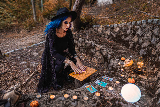 Young witch, fortune teller reads Tarot cards.