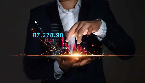 istock Businessman Holding Tablet with Growing Virtual Hologram of Statistics, Graph and Chart. Business Strategy Development and Growing Growth Plan. 1339459676