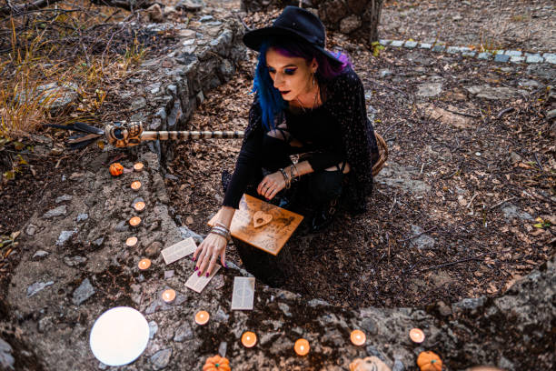 istock Young witch, fortune teller reads Tarot cards. 1339459716