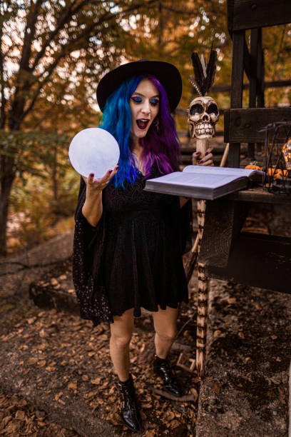 istock The witch casting a spell in her ritual. Preparing for Halloween. 1339459730