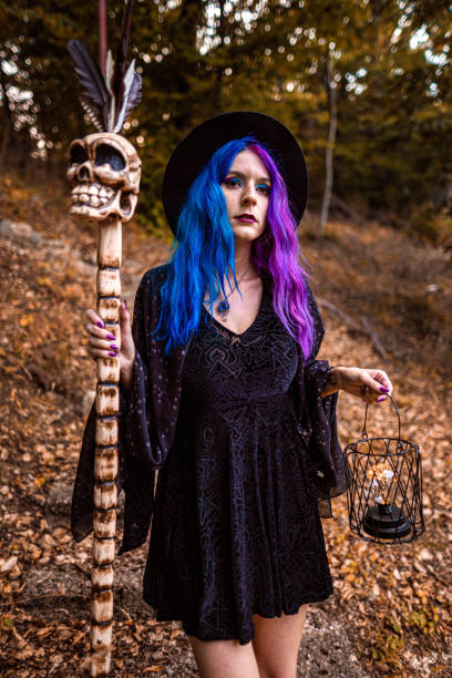 young witch with violet hair in the forest. - magic magic trick vertical tarot cards imagens e fotografias de stock