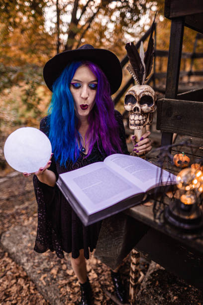 istock The witch casting a spell in her ritual. Preparing for Halloween. 1339459870