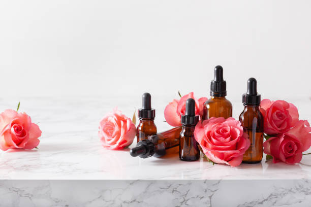 istock essential oils in bottles rose flowers. alternative medicine spa aromatherapy 1339460604
