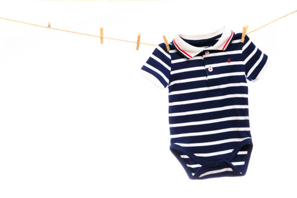 istock Baby clothes on a clothesline on white  background - Image 1339462200