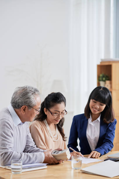 istock Real Estate Agent Asking Senior Couple 1339463749
