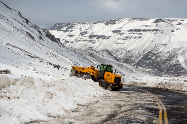 istock Tractor tires with chains in the snow 1339466723
