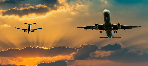 istock Airplanes taken off or landing among clouds 1339468406
