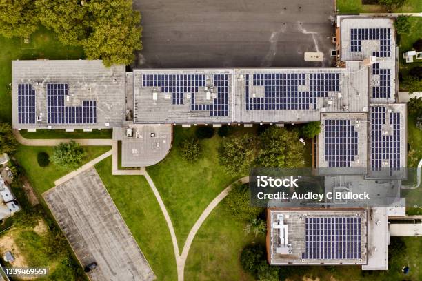 Top Down Shot Directly Over A School With Solar Panels On The Roof Stock Photo - Download Image Now