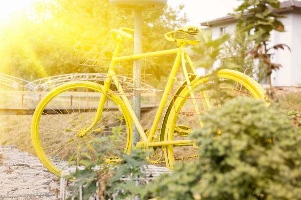 istock Yellow wheel illuminated by sunlight. Bycicle 1339472453