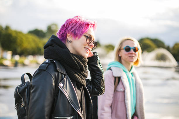 istock Friends walking in park 1339475097