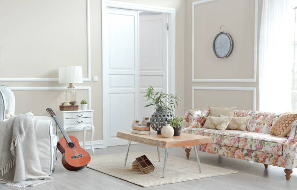 modern home interior living room in style design with sofa pillow blanket of window table curtain rug armchair guitar and vase flower plant
