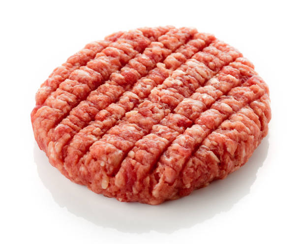 istock Raw hamburger patty isolated on white 1339481633