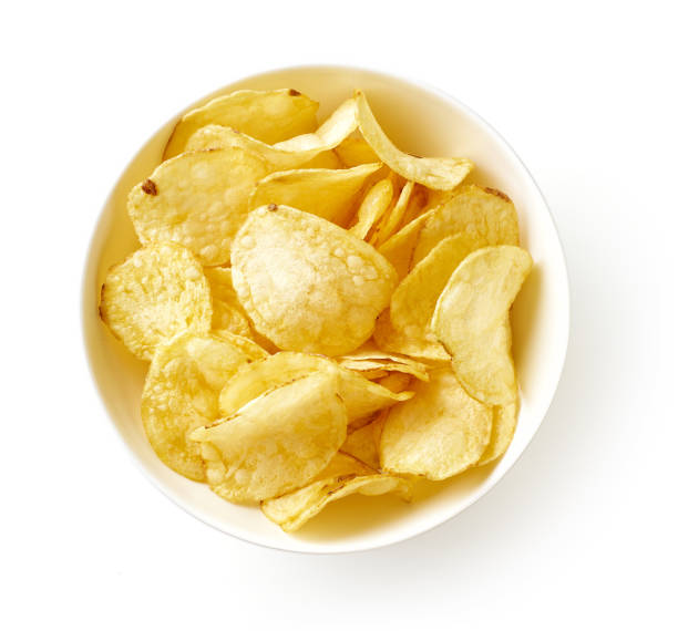 istock Potato chips isolated on white background, from above 1339481654