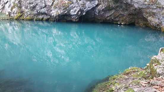 The source of Gorgazzo, in Polcenigo, is a underwater cave where the homonymous torrent originates, the tributary of the River Livenza. Shot in a winter cloudy and rainy day