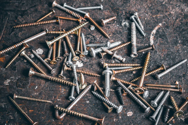 istock A lot of screws on wood workbench. 1339484899
