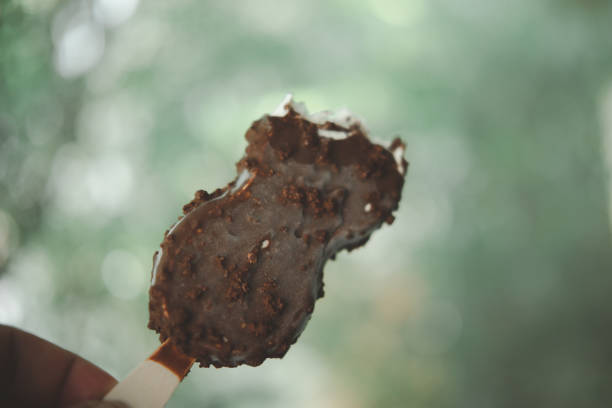 istock Bitten chocolate popsicle ice cream in hand 1339489557