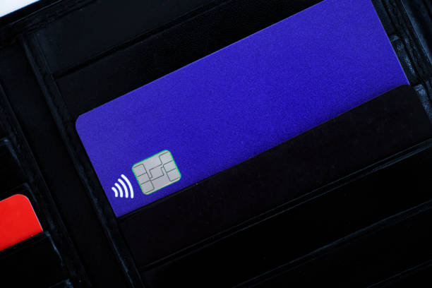 istock bank card black wallet background 1339492897
