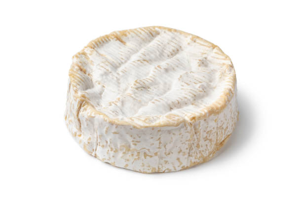 istock Whole French Camembert cheese on white background 1339493631