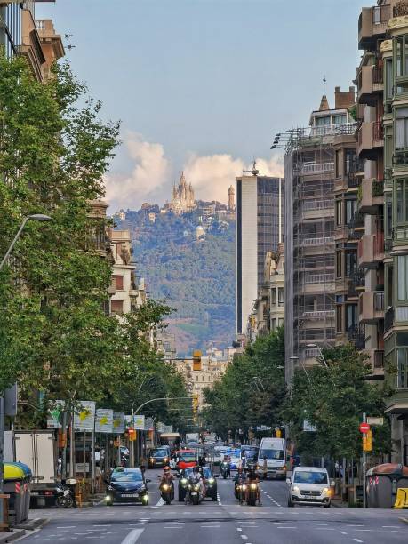 September 10, 2021 - Barcelona, Spain: Balmes street in Barcelona in the morning, with road traffic. Tibidabo is in the background