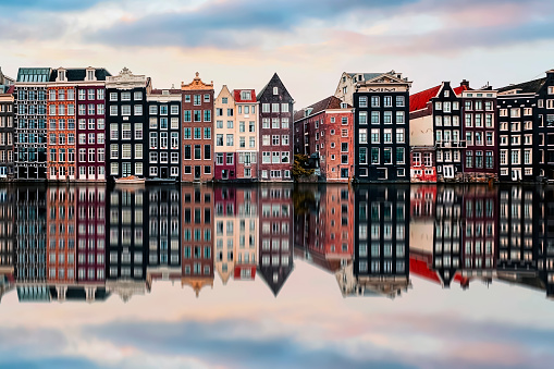 Buildings in Damrak avenue, Amsterdam city, Netherlands