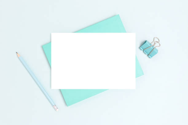 istock Blank paper card mockup and stationery on a blue background. 1339502302