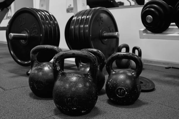 istock kettlebell weights on rubber floor ready for strength and conditioning workout, black and white image 1339505567