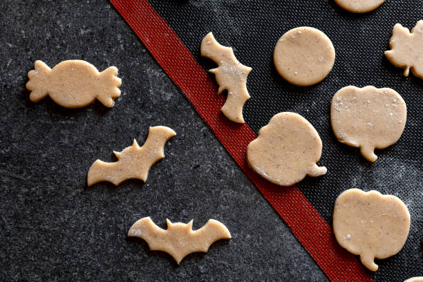 istock cooking cookies halloween pumpkin bat gingerbread baking mat 1339507386