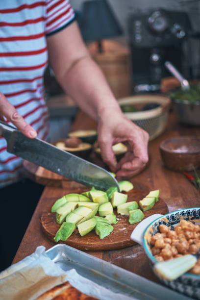 istock Preparing Vegan Pizza with Chickpeas and Avocado 1339509384